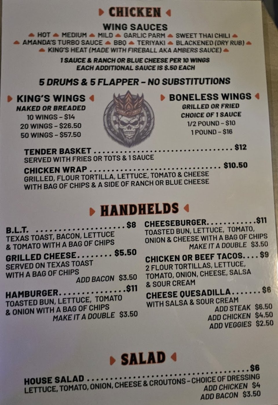 Printed menu with wings, starters, and sides.